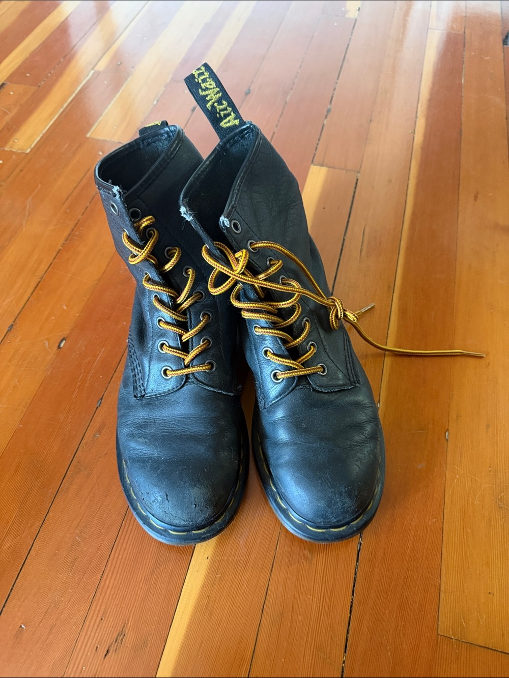 Dr. Martens Black Leather Boots with Yellow Laces